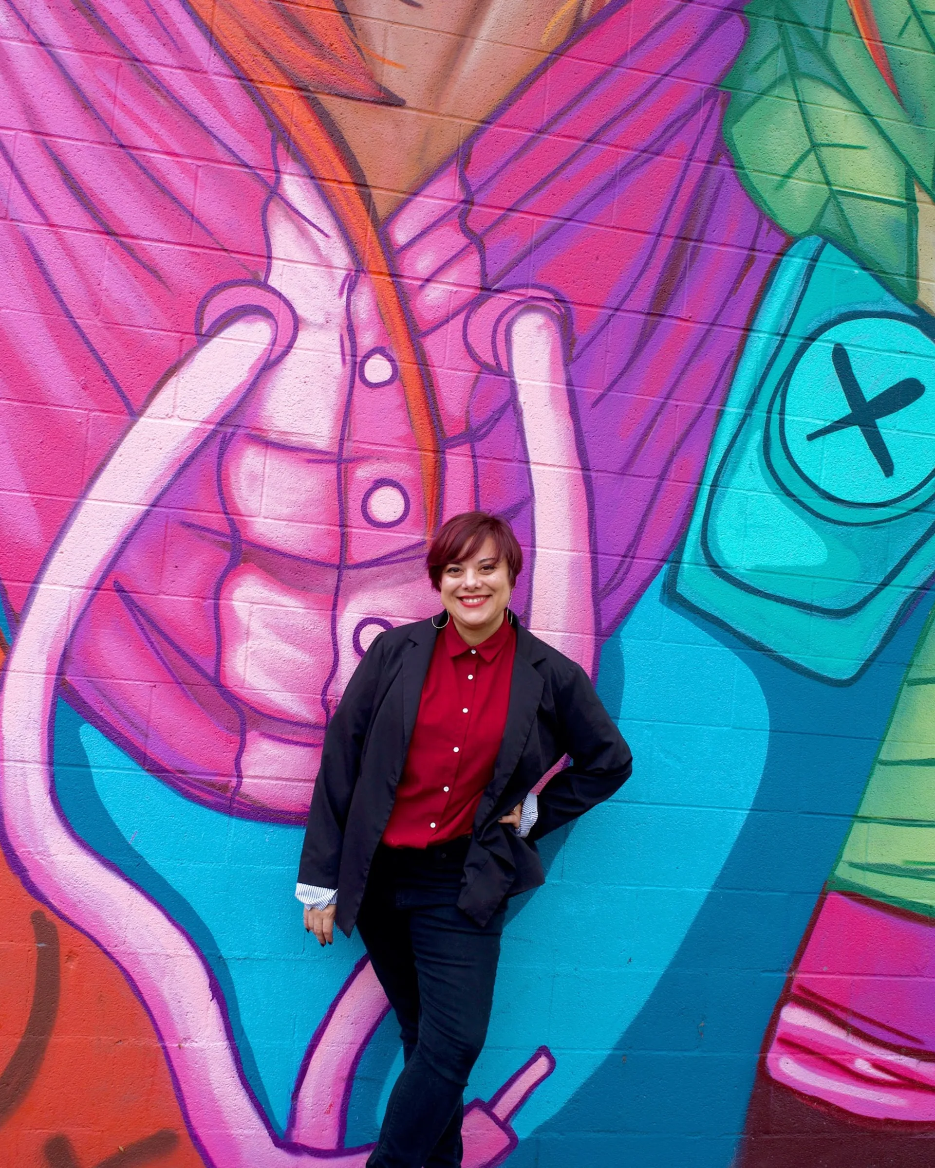 Hazel Quimpo in front of a mural